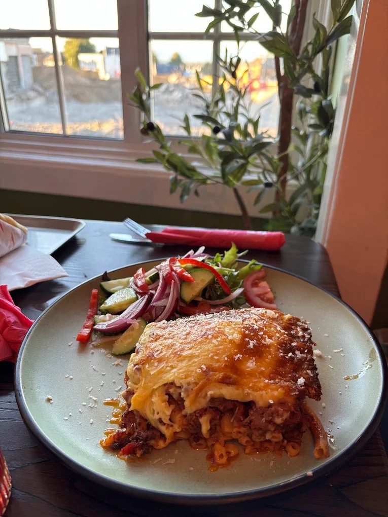  Slice of Classic Pastitsio, a Greek baked pasta dish with meat ragu and 
béchamel, served with a side salad at Greek Theory, Falkirk