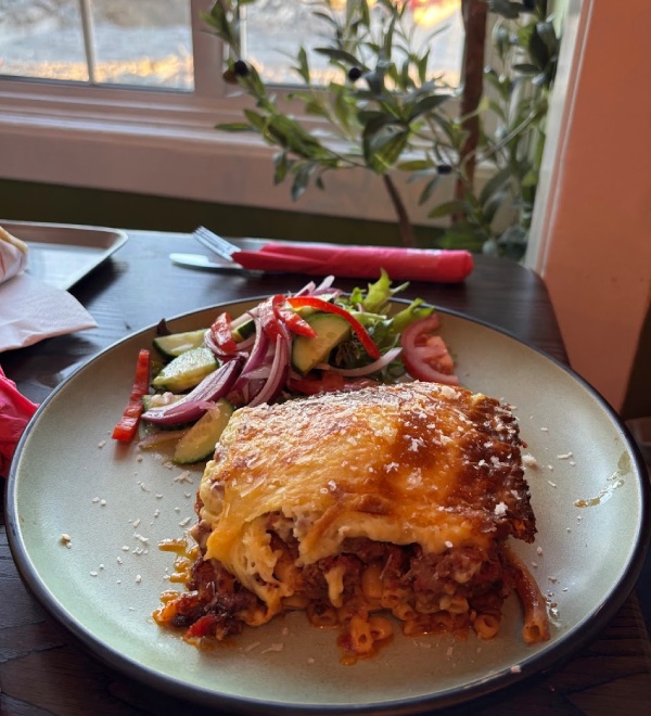 Classic Greek baked pasta dish with rich ragu served in Greek Theory, Falkirk. 